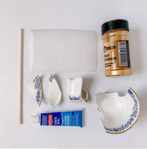 Set of Kintsugi how-to tools, featuring brushes, lacquer, and gold powder for mastering the art of Kintsugi repair