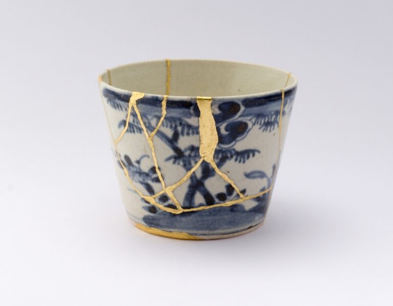 The art of Kintsugi showcased in beautifully repaired bowls with gold, highlighting Japanese craftsmanship and the beauty of imperfection.