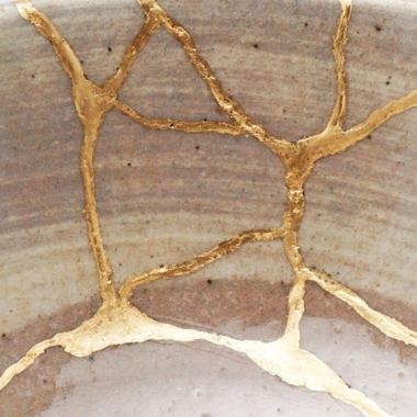 Close-up of Kintsugi cracks, showcasing the delicate golden seams that highlight the beauty of imperfection and repair